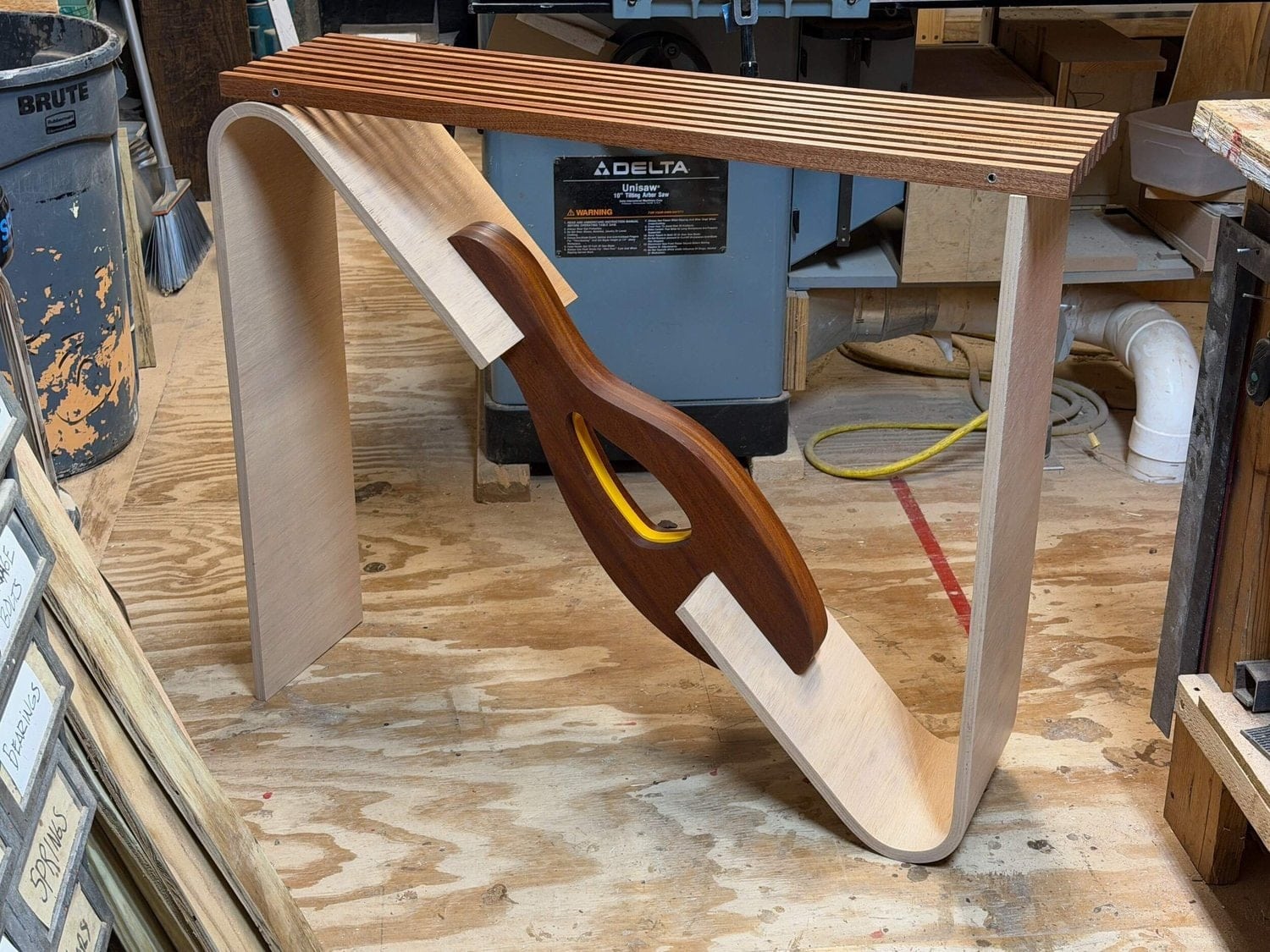 Ric’s table with a sweeping bent plywood support and slatted wooden top